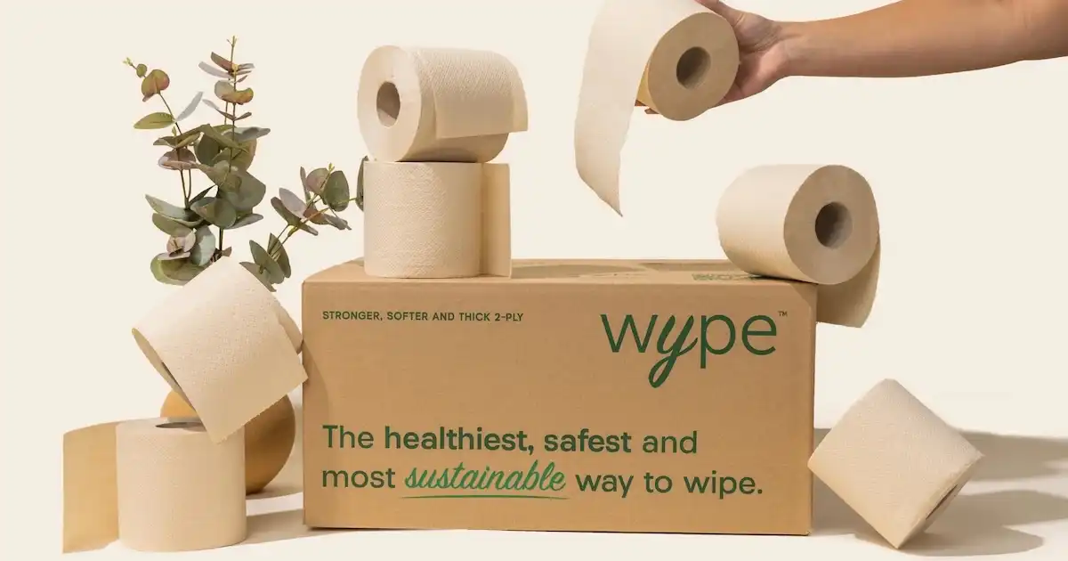 A stack of toilet paper on top of a box of Wype toilet paper.