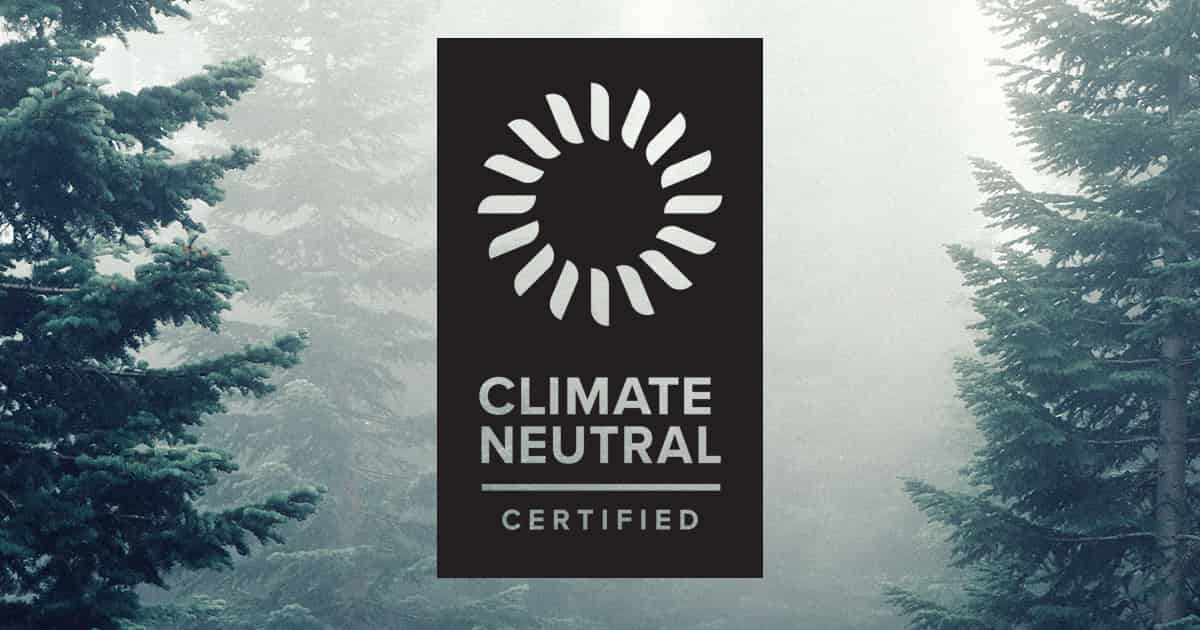 Carbon Neutral logo with trees in the background