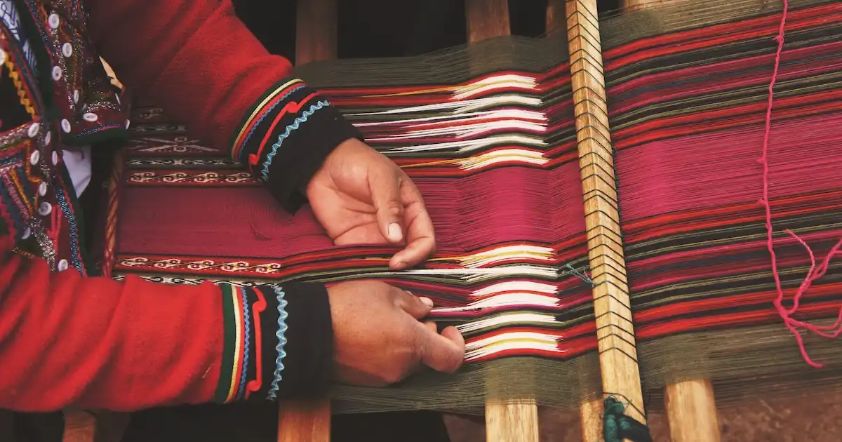 Person engaged in traditional Andean weaving